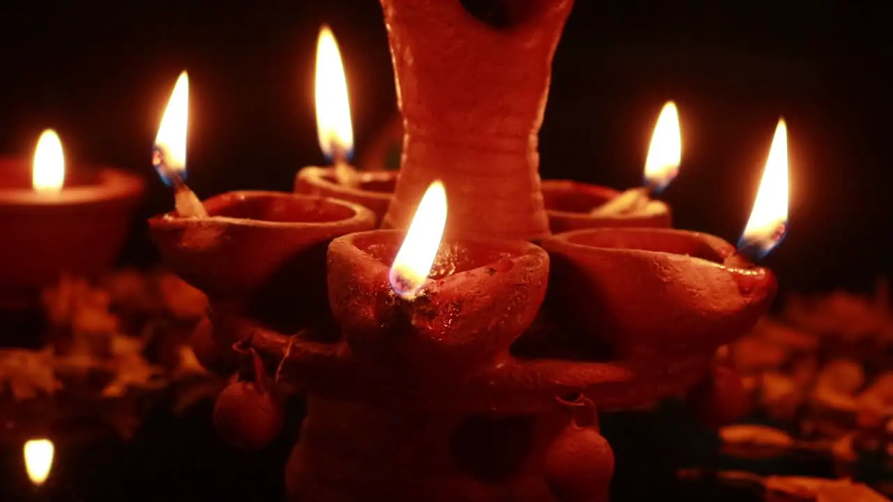 Showing a mud lamp glowing beautifully during Diwali in India