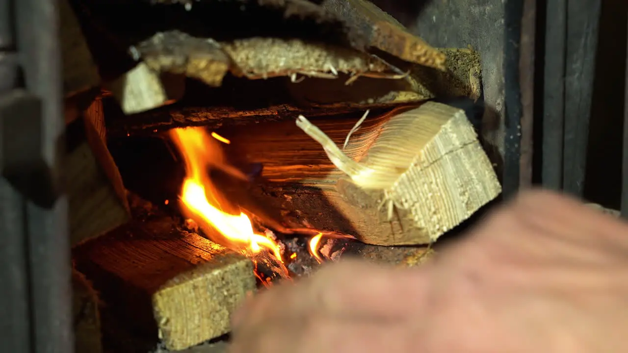 Burning firewood in fireplace for heating the house heating season