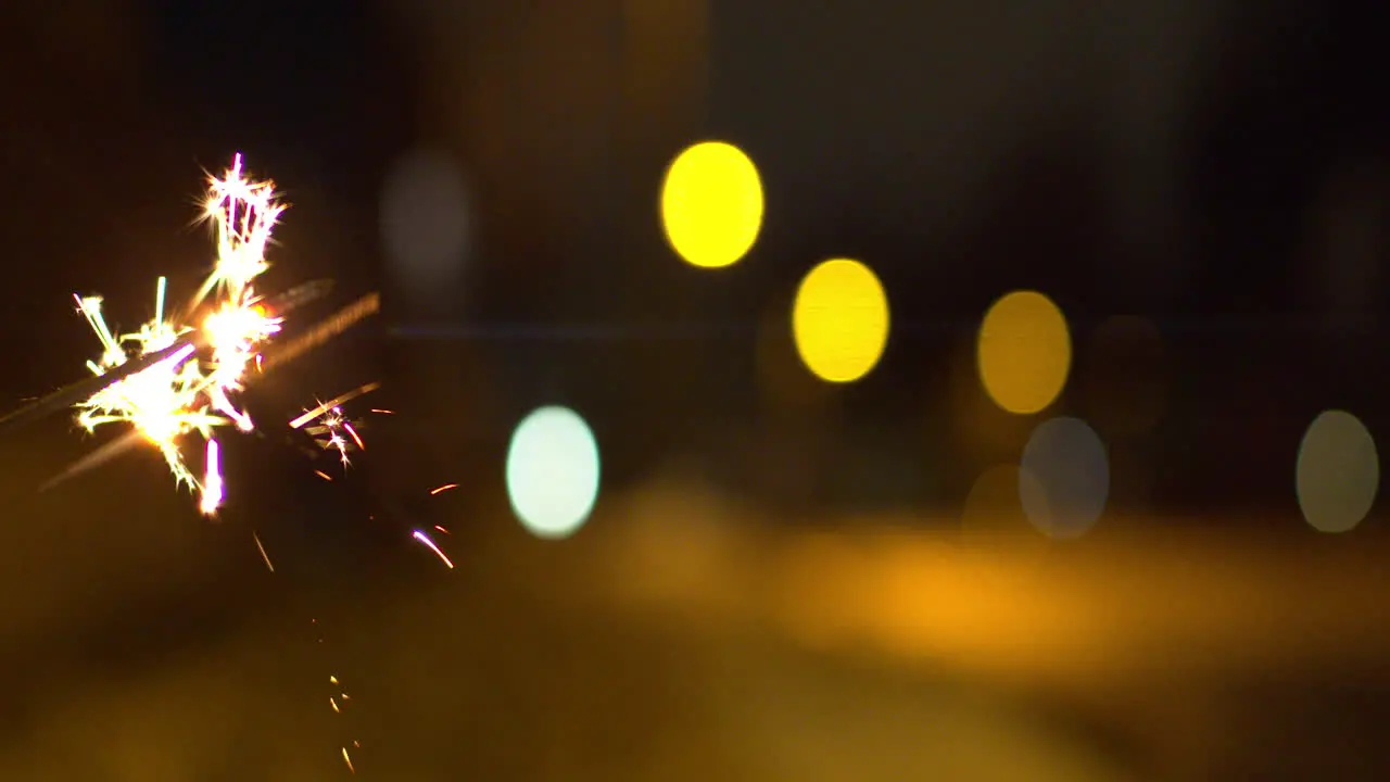 Male hand holding sparklers