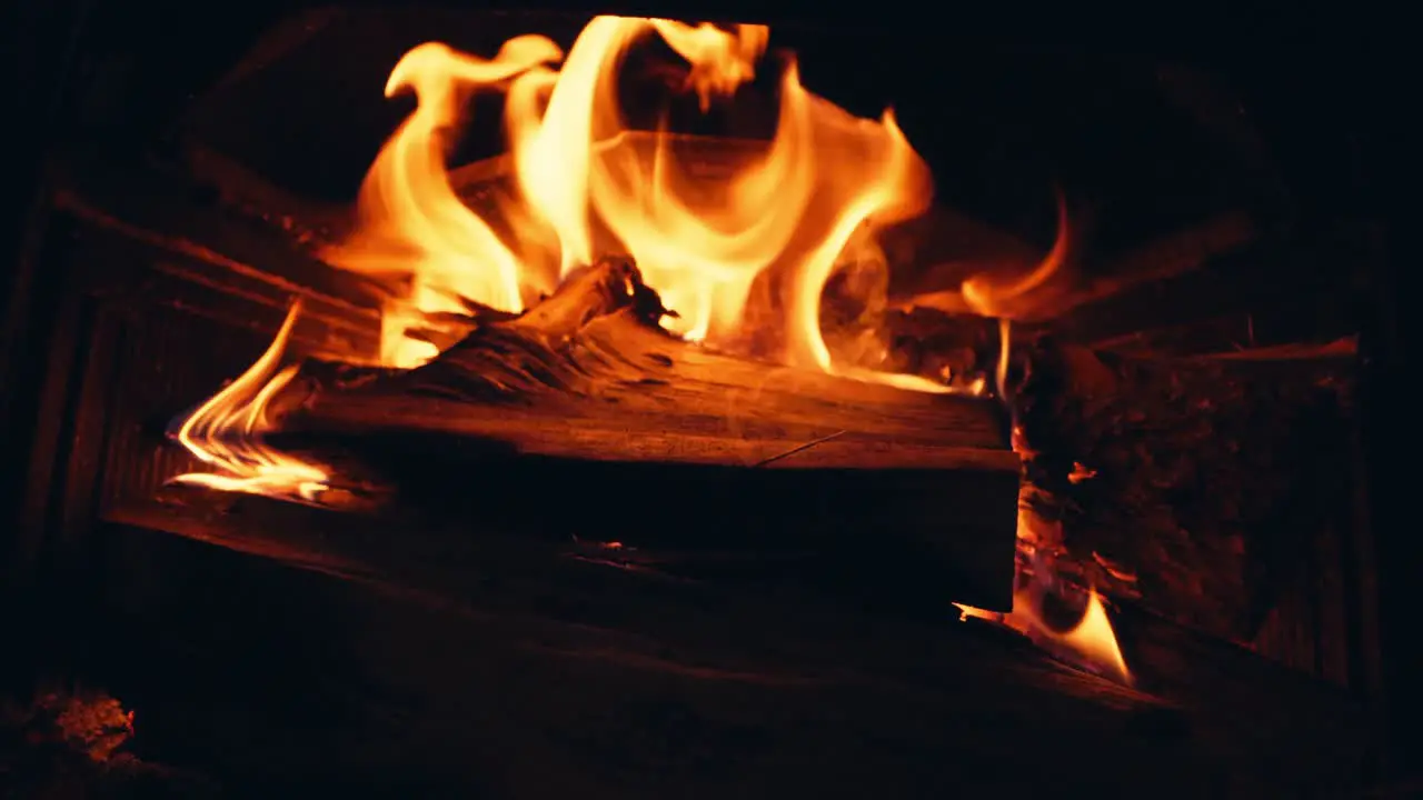 Wood Burning In The Fireplace With Red Hot Coals close up