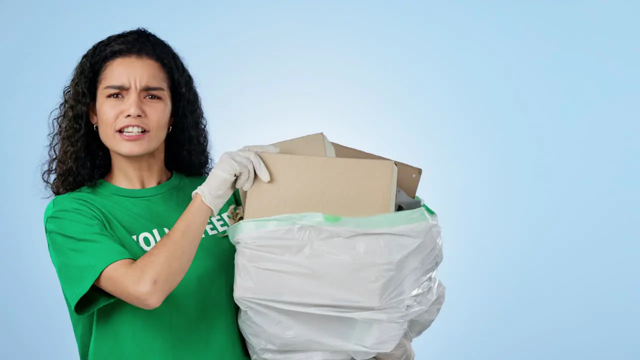 Woman volunteering and thumbs up for garbage