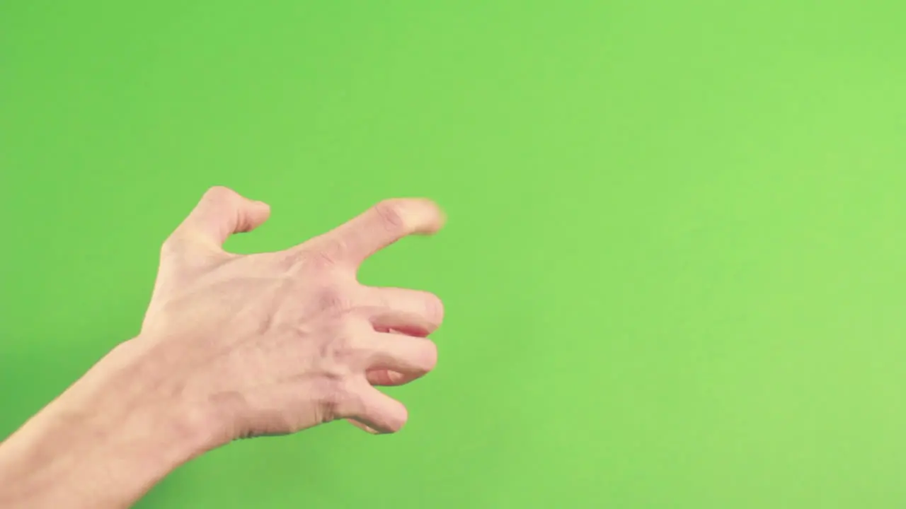 Isolated human hand on green background making gesture Chroma key studio