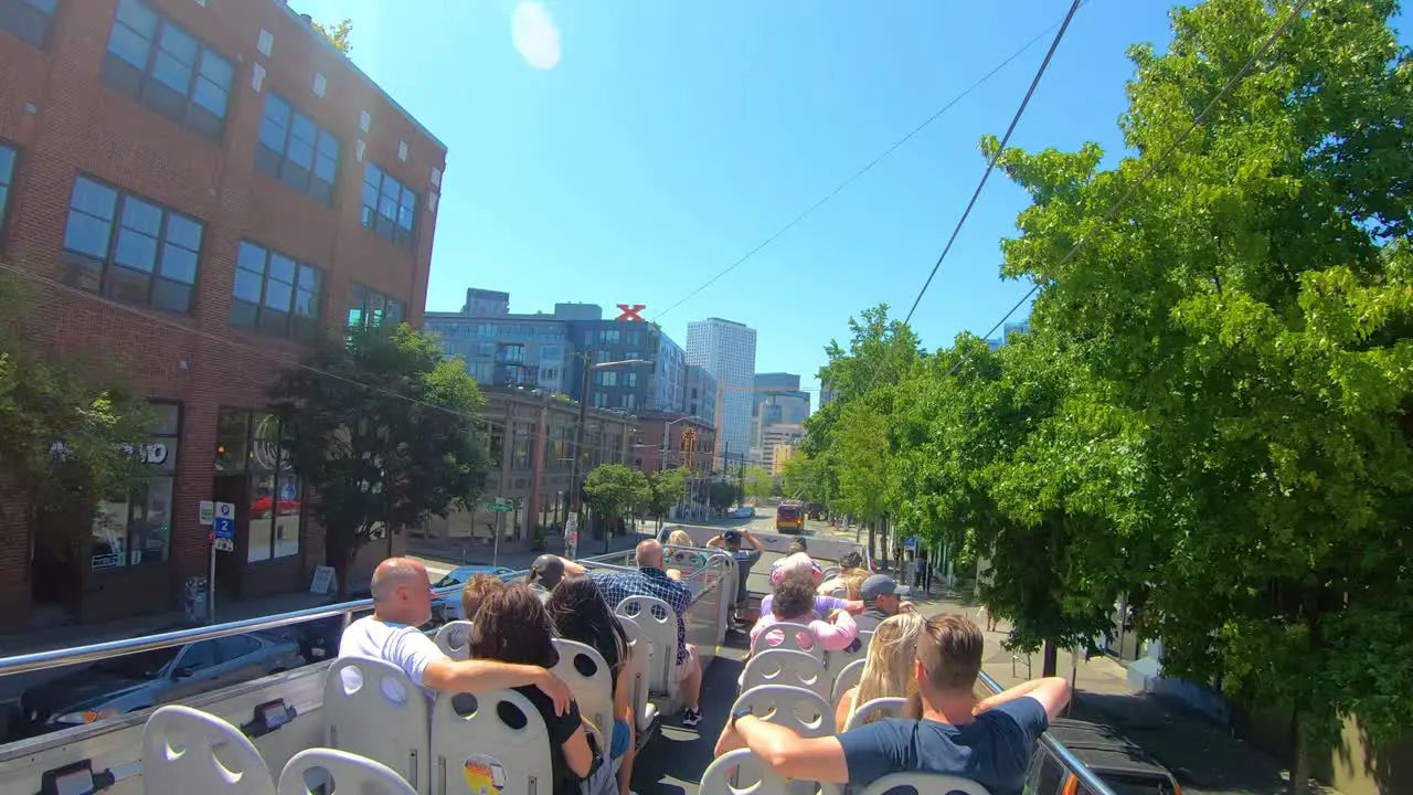 Seattle streets from tourist bus without roof sunny vacation day in Summer