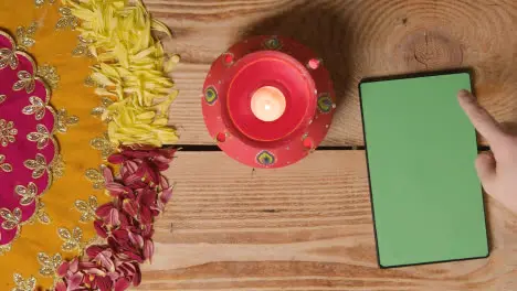 Clay Pot With Lights Being Used To Celebrate Indian Wedding Diwali Or Navratri On Decorated Table With Digital Tablet 3