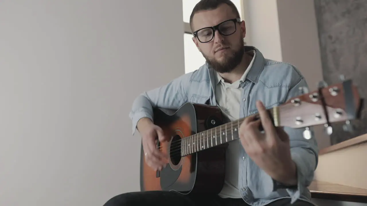 Male Musician Playing Guitar At Home 1