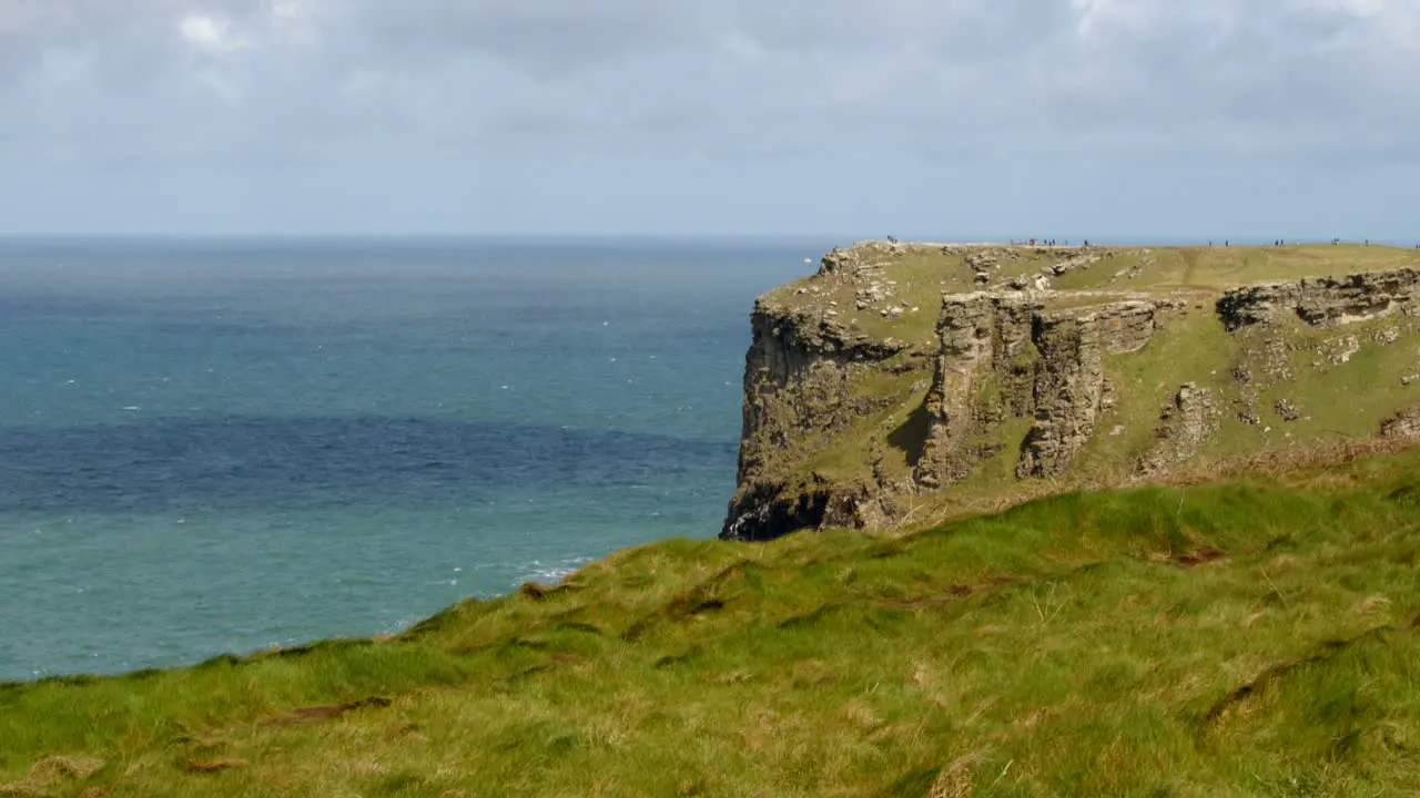 Wide shot looking at Tintagel cliffs from Lower Penhallic Tregatta