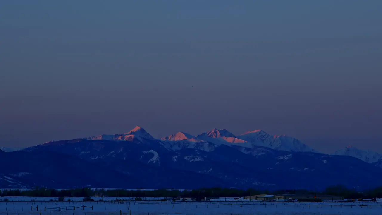 Timelapse of Snowy Mountain Sunrise Clear Skies