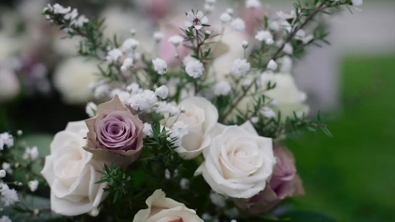 closeup of bridesmaid's flower on the ground