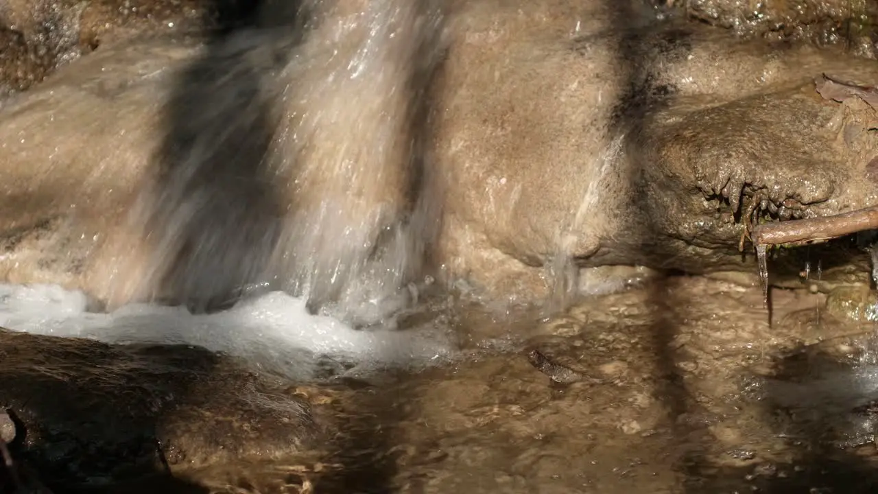 Small waterfall in a quiet creek in Switzerland