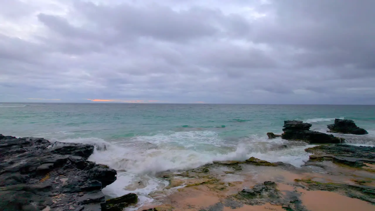 View of the sunrise over the Pacific Ocean from Sandy Beach on Oahu Hawaii