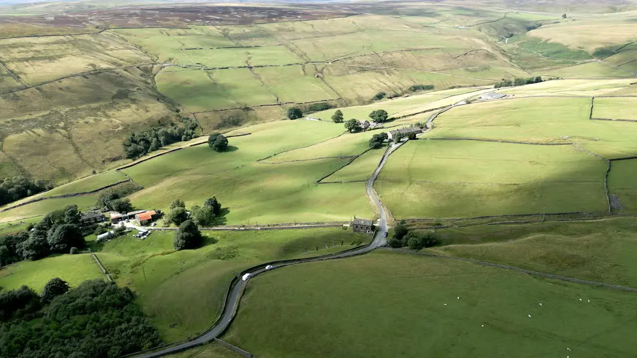 Summer farmland with patchwork fields panorama with groves and trees shot using a drone aerial footage