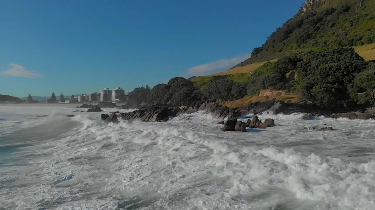 AERIAL SLOW MOTION Waves breaking over rocks clip 1