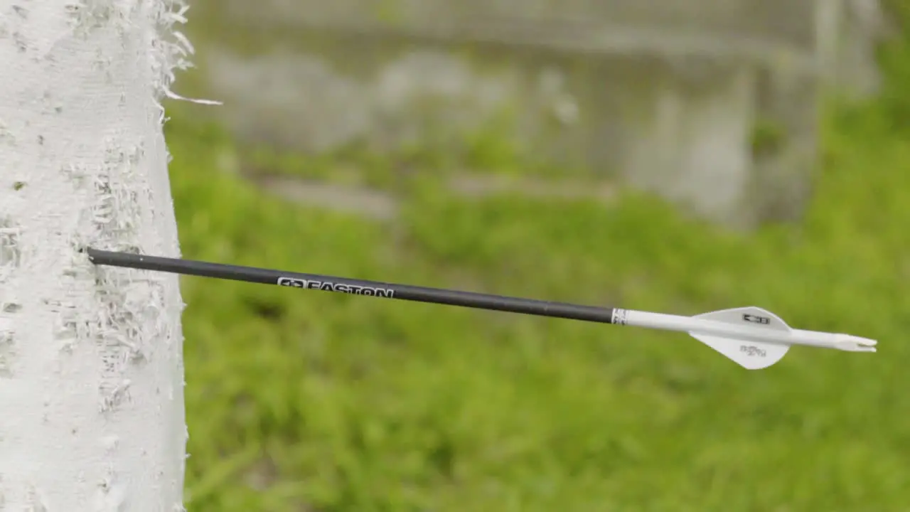 A side view of an arrow being shot into an archery bag in slow motion