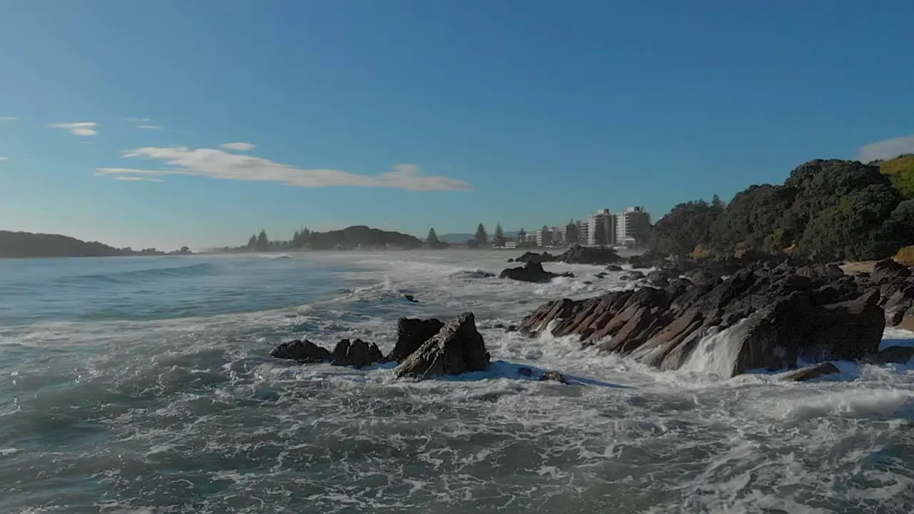 AERIAL SLOW MOTION Waves breaking over rocks clip 4