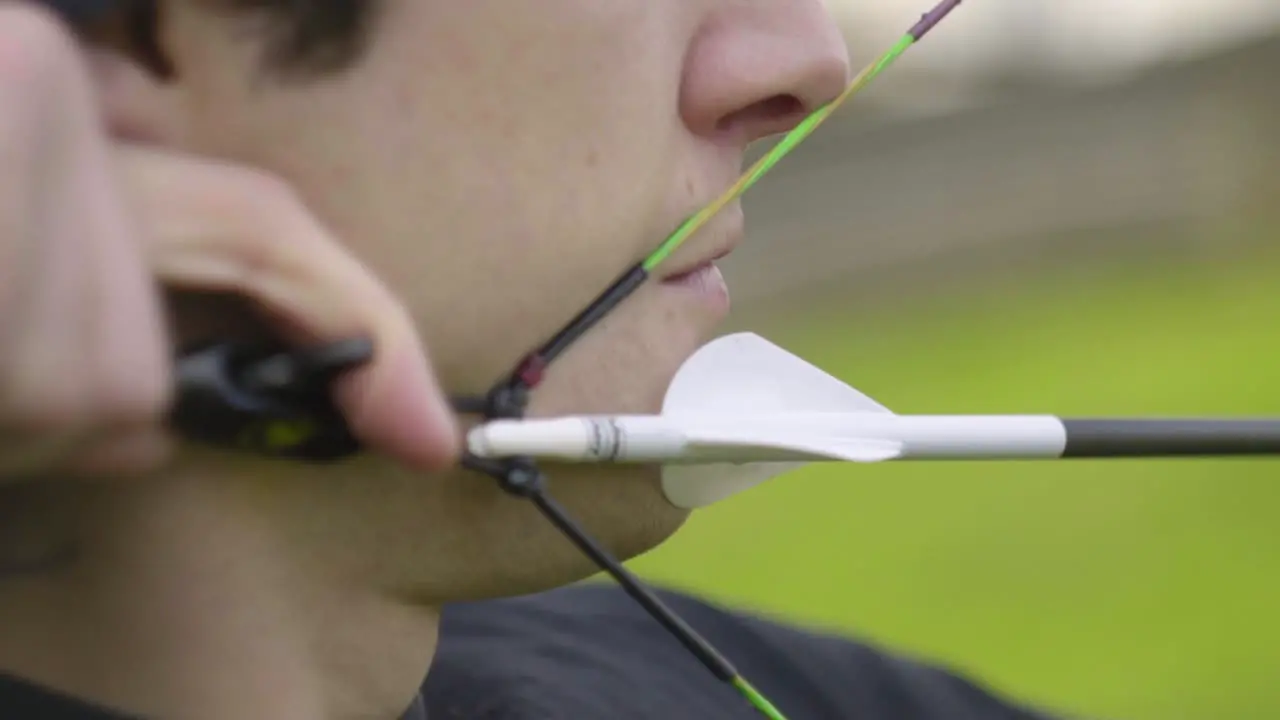 A close up shot of a nocked arrow with the compound bow at full draw