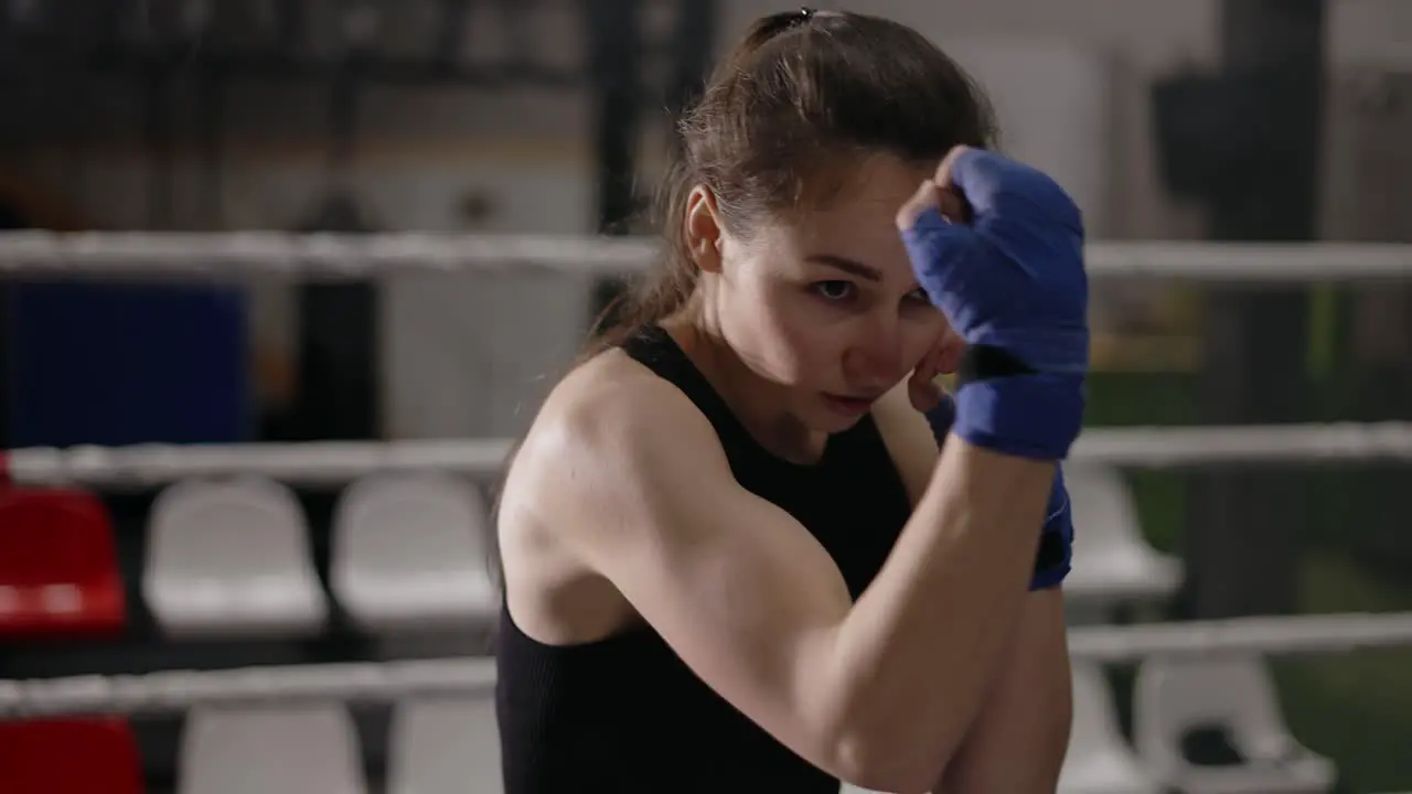 Female Boxer Performing Shadow Fight Punching Techniques