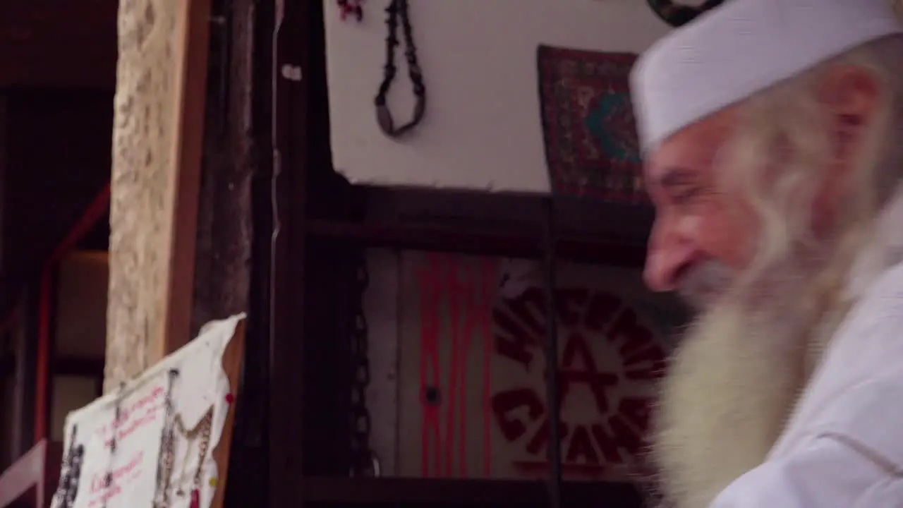 An old Bosnian Muslim man looks at the camera