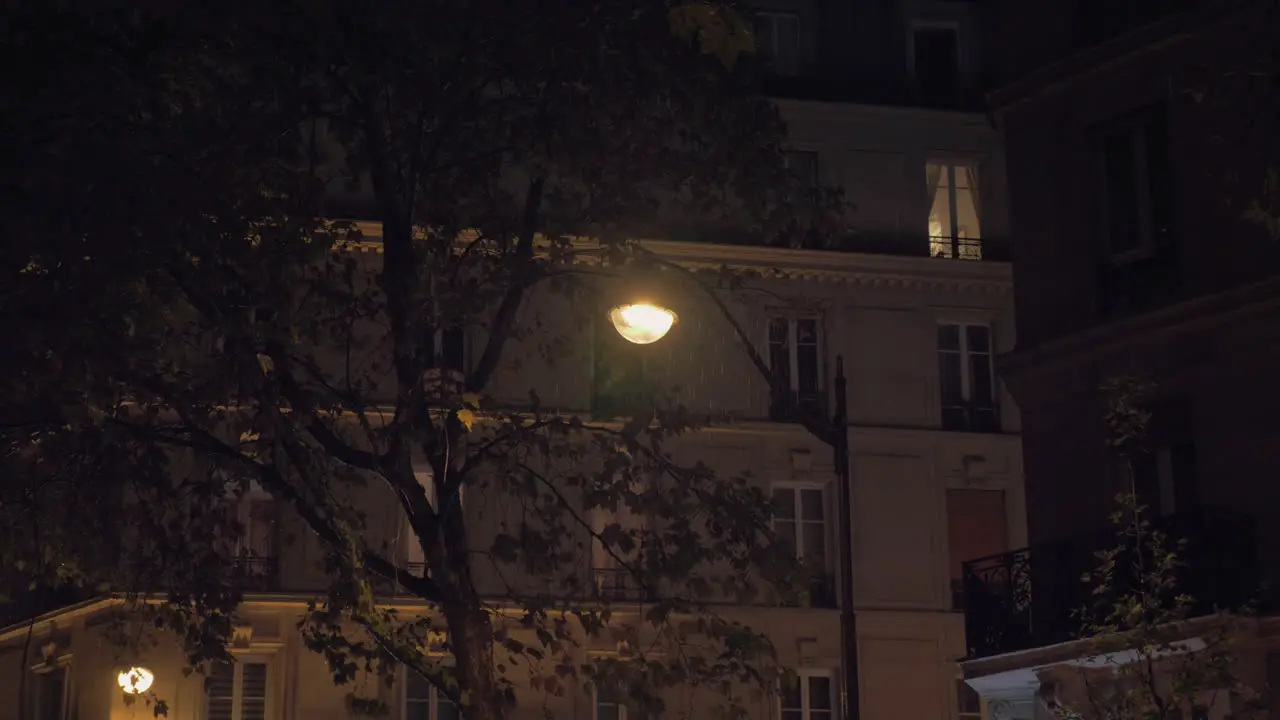 Drizzling at night Autumn in the city view to houses and outside lanterns