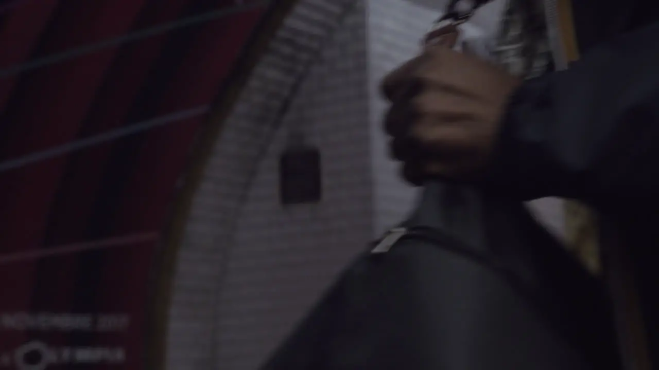 Woman opening doors and leaving subway train Paris France