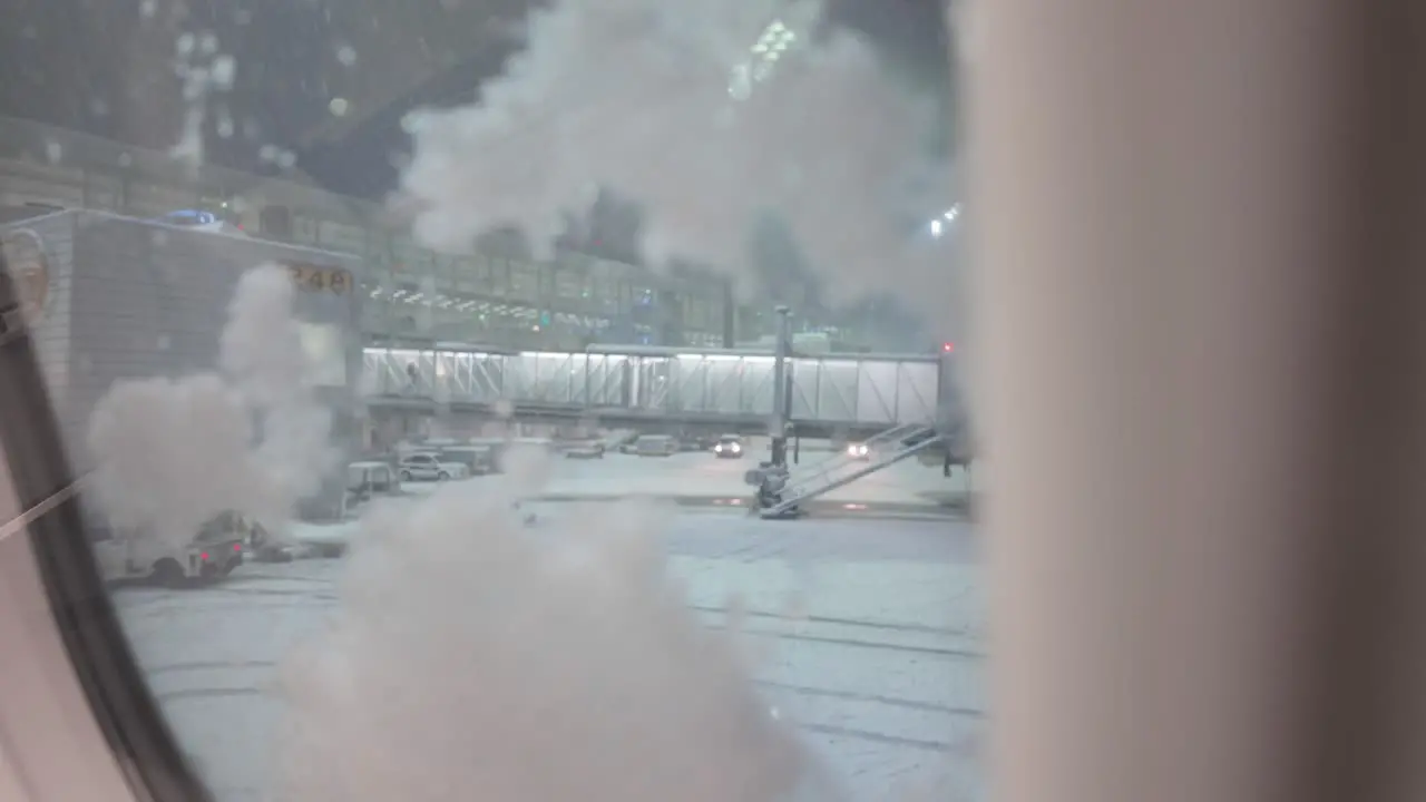 Ice Falling On Window Surface Of Airplane At Munich Airport In Winter