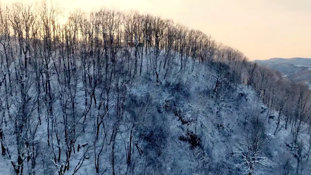 aerial push into the sunset in winter near boone nc north carollina