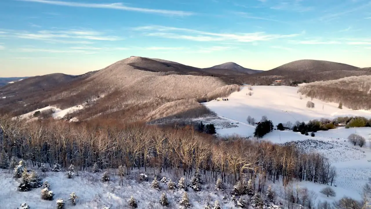 slow aerial pullout appalachian mountains in snow near boone nc