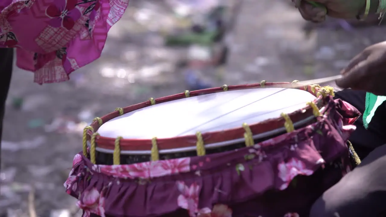 Playing a person's drum in a fair