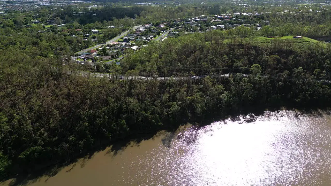 Oxenford Gold Coast 4 January 2024 Aerial views of the road adjacent to the Coomera River in Oxenford with stripped trees from the January storms