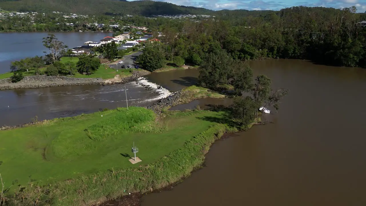 Oxenford Gold Coast 4 January 2024 Aerial views of the Coomera River residential housing and Causeway with receding flood waters from the January storms