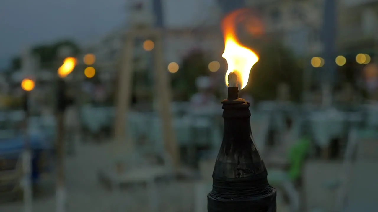 Burning tiki torch at twilight