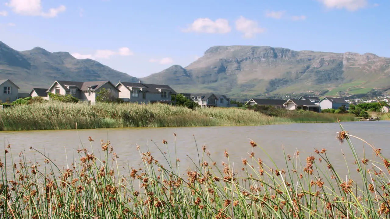 View of reeds lake houses and mountains form lakeshore