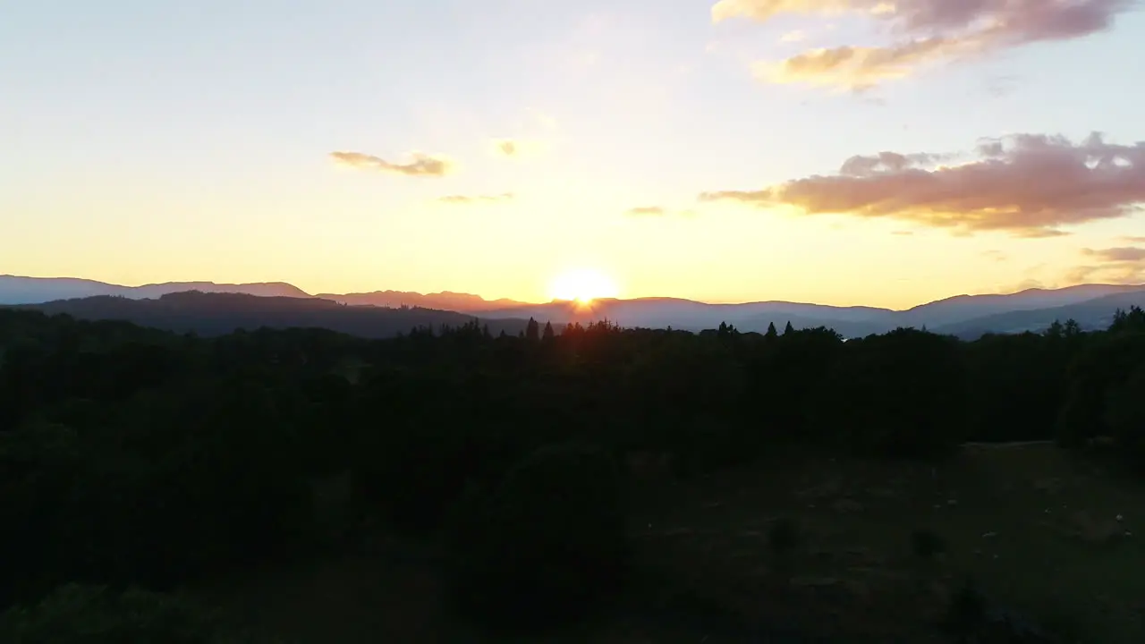 Drone shot of sunset over Lake Windermere and the surrounding countryside Lake District UK