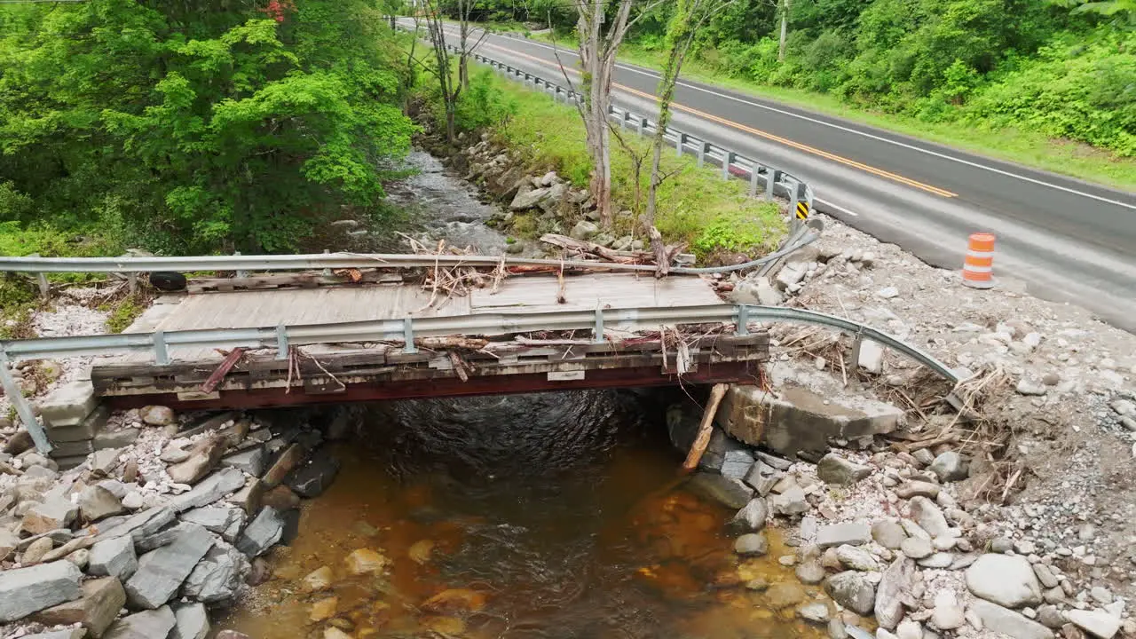 Lowering Aerial View Close-up of Flood-Damaged Bridge in Plymouth Notch VT