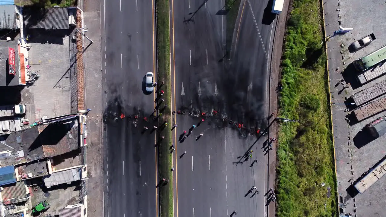 Angry indigenous people protesting with blocking the panamerican highway in Ecuador