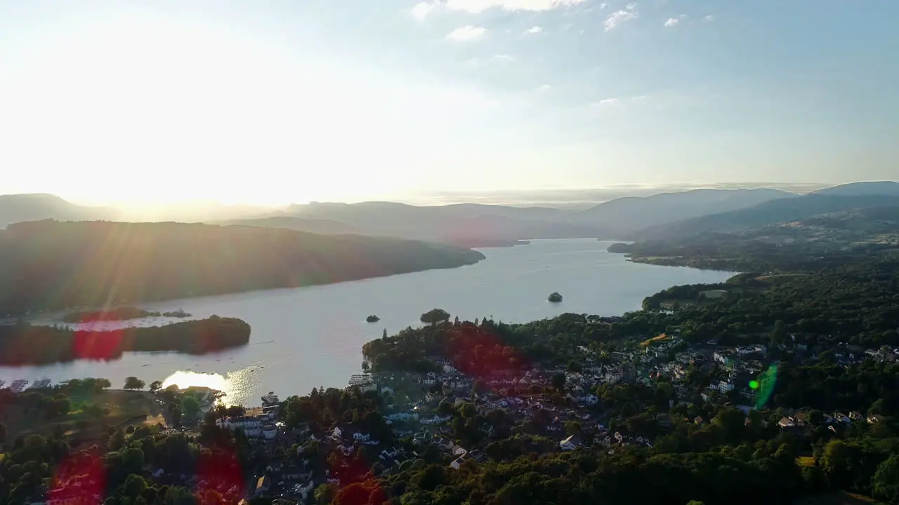 Aerial view of the village on the lakeshore and surrounding countryside at Lake Windermere Lake District UK