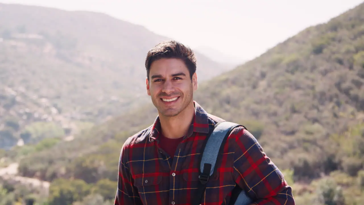 Young man taking a break during a mountain hike