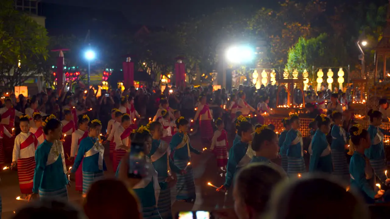 Mass candle dance with many performers at Yi Peng festival in Thailand