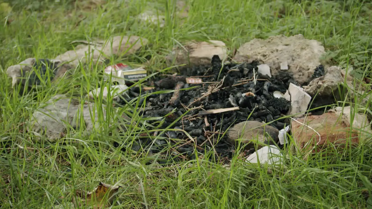 An abandoned fireplace at a campsite at the lake