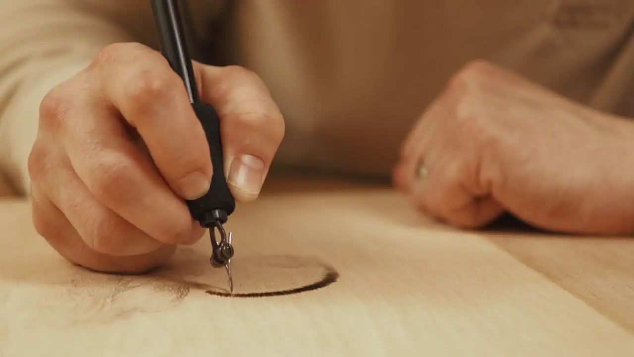 Close up timelapse footage of artist woodburning