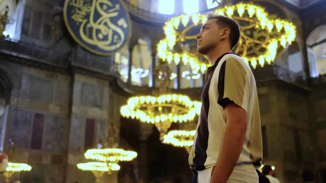 Low Angle Shot of Young Man eExamining Interior of Hagia Sophia