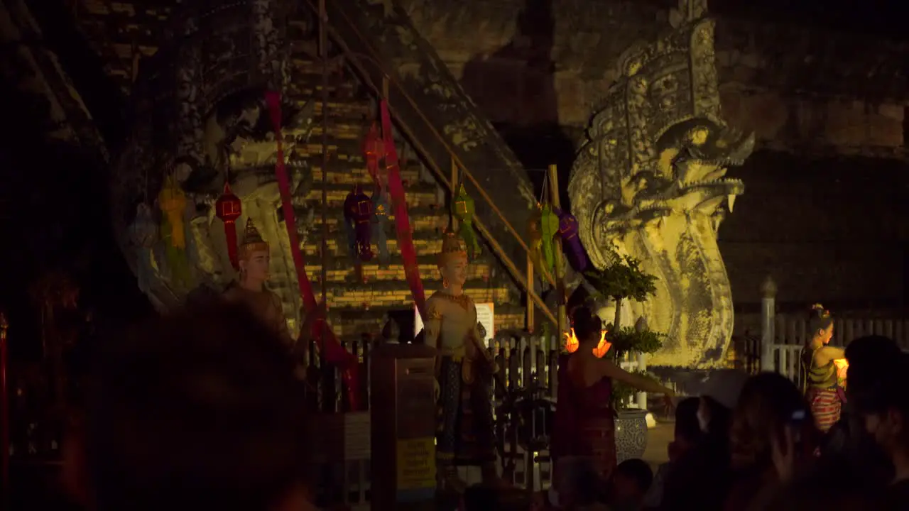 Traditional Thai performs dancing in front of Temple at night