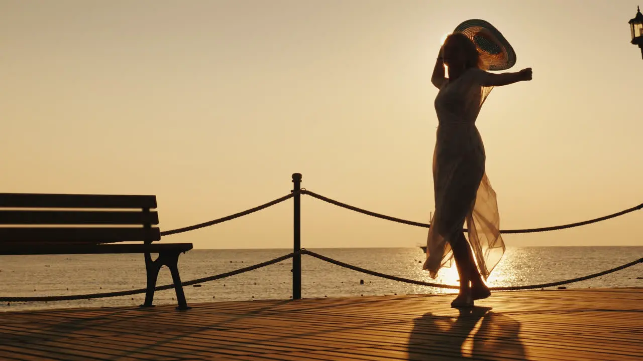 The Woman Is Happily Spinning On The Pier Holding A Hat In Her Hand The Sunrise Meets Happy Woman On