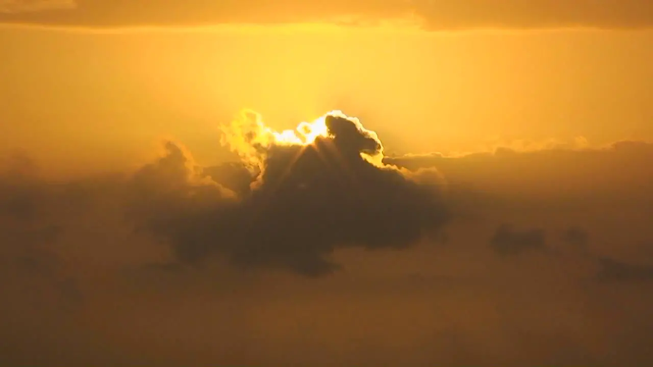 A passing cloud partially eclipses the bright sun