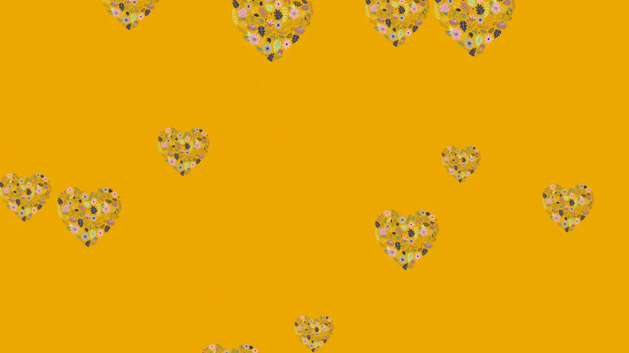 Animation of flower hearts moving in hypnotic motion with copy space on orange background