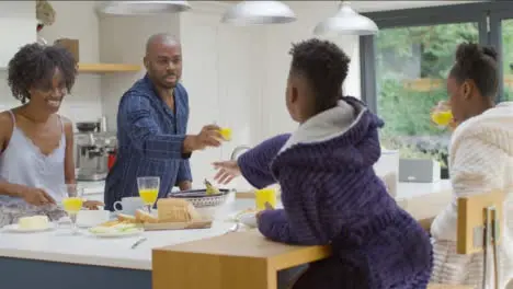 Family Having Breakfast Together at a Kitchen Island 