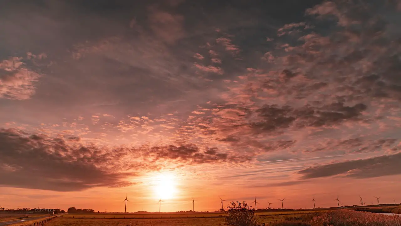 A timelapse video of a dramatic sunset above the rural landscape