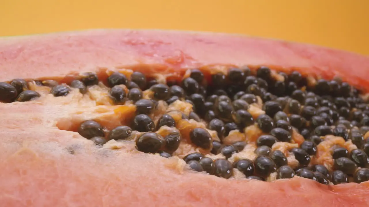 Fresh papaya against yellow background