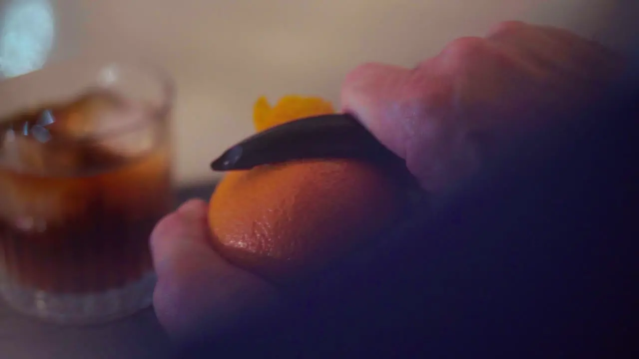 Preparing a martini cocktail rum orange and ice