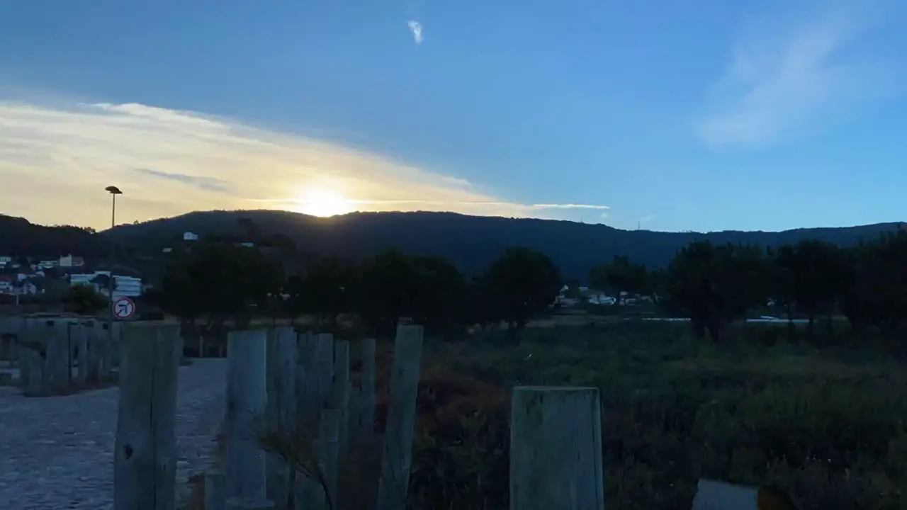 Sunrise behind the mountains with some clouds