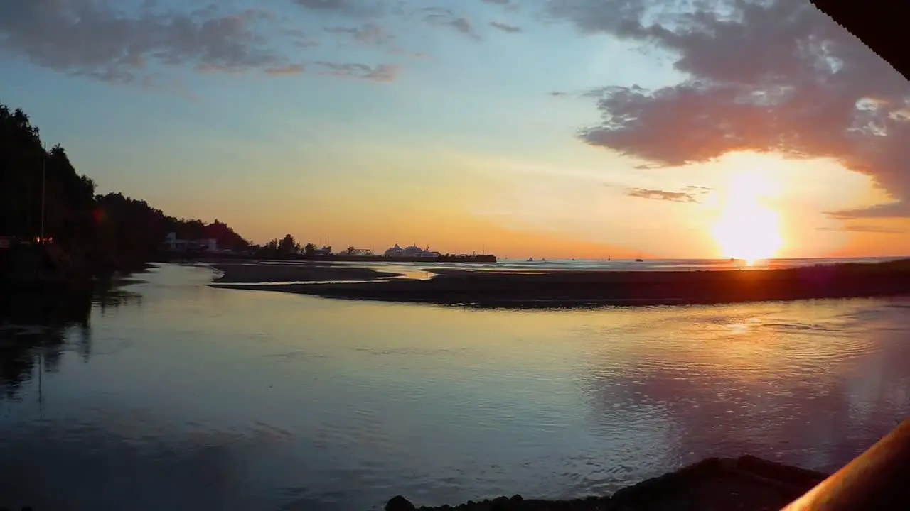 Sunset time lapse of the harbour in Quepos Costa Rica with numerous boats making their way back to the docks